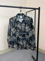 Premium black shirt with red and white nebula style abstract print on Chelli fabric.