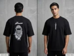 Back and front view of a premium black drop shoulder cotton t-shirt featuring 'Musafir' Arabic calligraphy and a traditional keffiyeh graphic.